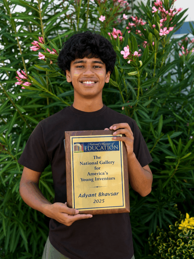 Adyant Bhavsar with his NMOE award.